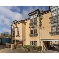 Next to the Palace and Royal Mile with parking