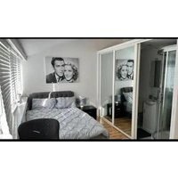 An En-suite with a mini kitchen and a work space