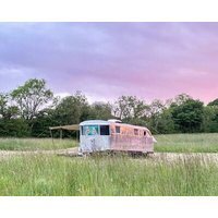 Off-grid trailer stay with valley views and dark skies