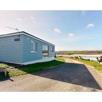 Situated on level ground sea front position overlooking the beach with excellent views of the bay