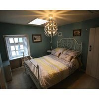 A Charming And Cosy Cottage Centrally Located On Bridge Street.